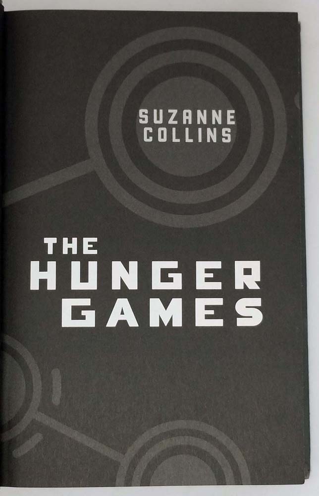 The Hunger Games. by Suzanne Collins. First Edition First 