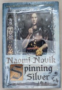 New York Times best seller “One of the year’s strongest fantasy novels” (NPR), an imaginative retelling of the Rumpelstiltskin fairy tale from the best-selling author of Uprooted. Nebula and Hugo Award Finalist Named one of Paste's Best Fantasy Books of the Decade Named one of the top 10 books of the year by The New York Public Library and one of the best books of the year by: The New York Times Book Review; NPR; Time; Tor.com; PopSugar; Vox; Vulture; Paste; Bustle; Library Journal With the Nebula Award-winning Uprooted, Naomi Novik opened a brilliant new chapter in an already acclaimed career, delving into the magic of fairy tales to craft a love story that was both timeless and utterly of the now. Spinning Silver draws listeners deeper into this glittering realm of fantasy, where the boundary between wonder and terror is thinner than a breath, and safety can be stolen as quickly as a kiss. Miryem is the daughter and granddaughter of moneylenders, but her father’s inability to collect his debts has left his family on the edge of poverty - until Miryem takes matters into her own hands. Hardening her heart, the young woman sets out to claim what is owed and soon gains a reputation for being able to turn silver into gold. When an ill-advised boast draws the attention of the king of the Staryk - grim fey creatures who seem more ice than flesh - Miryem’s fate, and that of two kingdoms, will be forever altered. She will face an impossible challenge and, along with two unlikely allies, uncover a secret that threatens to consume the lands of humans and Staryk alike.