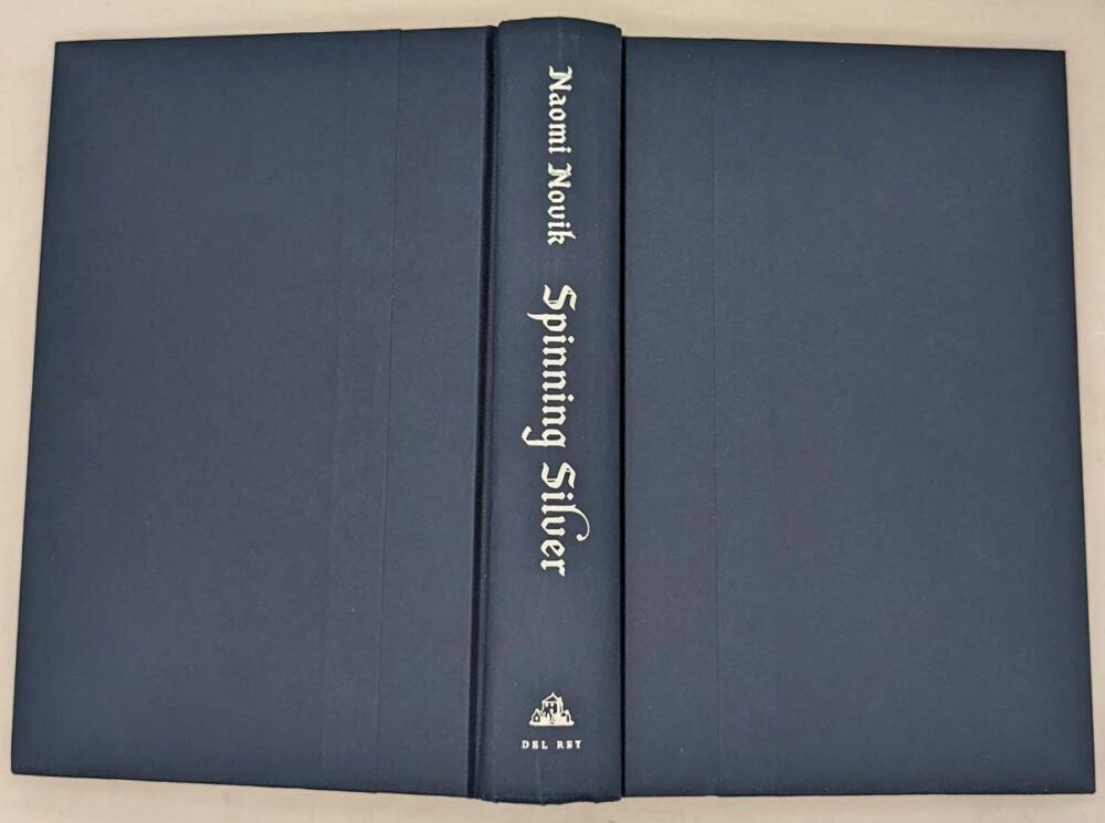New York Times best seller “One of the year’s strongest fantasy novels” (NPR), an imaginative retelling of the Rumpelstiltskin fairy tale from the best-selling author of Uprooted. Nebula and Hugo Award Finalist Named one of Paste's Best Fantasy Books of the Decade Named one of the top 10 books of the year by The New York Public Library and one of the best books of the year by: The New York Times Book Review; NPR; Time; Tor.com; PopSugar; Vox; Vulture; Paste; Bustle; Library Journal With the Nebula Award-winning Uprooted, Naomi Novik opened a brilliant new chapter in an already acclaimed career, delving into the magic of fairy tales to craft a love story that was both timeless and utterly of the now. Spinning Silver draws listeners deeper into this glittering realm of fantasy, where the boundary between wonder and terror is thinner than a breath, and safety can be stolen as quickly as a kiss. Miryem is the daughter and granddaughter of moneylenders, but her father’s inability to collect his debts has left his family on the edge of poverty - until Miryem takes matters into her own hands. Hardening her heart, the young woman sets out to claim what is owed and soon gains a reputation for being able to turn silver into gold. When an ill-advised boast draws the attention of the king of the Staryk - grim fey creatures who seem more ice than flesh - Miryem’s fate, and that of two kingdoms, will be forever altered. She will face an impossible challenge and, along with two unlikely allies, uncover a secret that threatens to consume the lands of humans and Staryk alike.